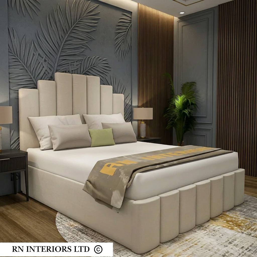 A modern upholstered bed with a tall segmented headboard and matching footboard, shown in a styled bedroom interior. The bed is dressed in white bedding with neutral pillows and a folded throw blanket.